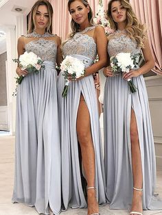 three bridesmaid posing for the camera with their dresses in grey and white colors