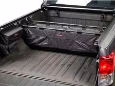 the back end of a pickup truck with its cargo compartment open