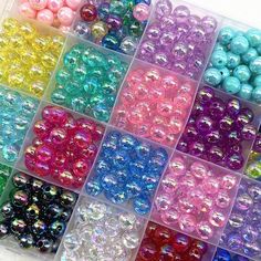 many different colors of beads in a box