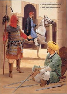 two men dressed in medieval clothing sitting on the ground with one man standing next to a horse