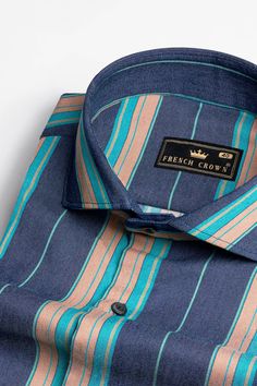 Unleash your casual cool with the Indigo Blue Denim Shirt featuring Copperfield Brown and Bahama Blue stripes. The denim fabric exudes laid-back charm, while the unique stripe combination with a cutaway collar adds a touch of flair to your outfit. Whether it's a day out with friends or a weekend adventure, this shirt will keep you looking effortlessly stylish. Embrace the timeless appeal of denim with a modern twist! Fused collar and cuffs, collar stand and flat felled side seams provide structu Blue Denim Shirt With Spread Collar, Blue Denim Top With Spread Collar, Fitted Denim Blue Shirt For Summer, Casual Blue Yarn-dyed Shirt, Classic Blue Denim Shirt, Blue Yarn-dyed Cotton Shirt, Blue Yarn-dyed Relaxed Fit Tops, Classic Denim Blue Shirt For Summer, Blue Yarn-dyed Tops With Relaxed Fit