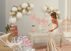 a pregnant woman standing in front of a table with cake on it and balloons hanging from the ceiling