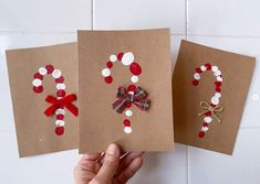 three handmade christmas cards with red, white and green decorations