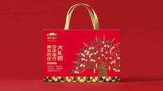 a red shopping bag with chinese writing on it and a tree in the middle, against a red background