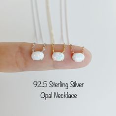 Tiny White Opal Stone Necklace Soft simple and adorable necklace is great for the gift: Mom, Wife, Grandma, Friends, Bridesmaids, and For You~ Stone Colors: White opal Nickel Free - Hypoallergenic Material: 92.5 Sterling Silver High Polish Gold, Rosegold and Rhodium Plated over Sterling Silver Chain Length: 17' + 2' extension Synthetic Opal Size: 7.5mm(W) * 5mm(H) Lobster Claw Clasp Ready for a Gift 🎁 RETURN POLICY : For any reason, if you are not satisfied with our product, you may return your White Sterling Silver Necklace As Gift For Her, Hypoallergenic Rose Gold Sterling Silver Charm Necklace, Nickel Free Rose Gold Sterling Silver Necklace, Nickel-free Rose Gold Sterling Silver Necklace, Rose Gold Sterling Silver Nickel-free Necklace, White Oval Necklace With Delicate Chain, Adjustable Oval Dainty Necklace, Dainty Oval Sterling Silver Charm Necklaces, Adjustable Dainty Oval Necklace