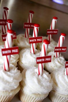 cupcakes decorated with red and white striped candy canes for north pole day