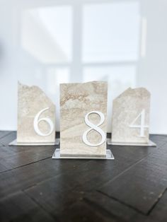 three marble blocks with the number eight on them