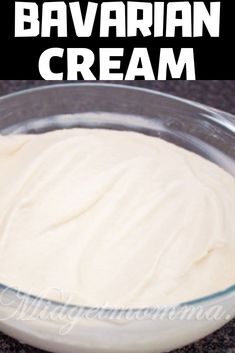 a bowl filled with batter sitting on top of a counter next to a black and white sign