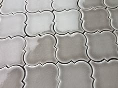 a close up view of a white tile