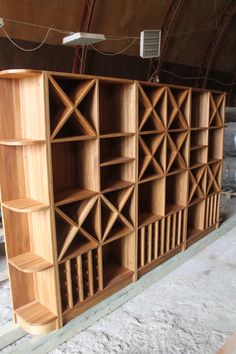 a large wooden bookcase sitting inside of a building