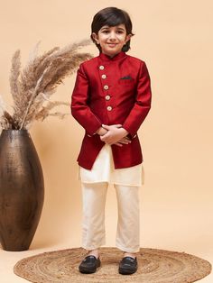 VASTRAMAY Boy's Maroon Indo Western Jacket With Cream Kurta And Pyjama Set Discover the perfect blend of tradition and style with the VASTRAMAY Boy's Maroon Indo Western Jacket With Cream Kurta And Pyjama Set. Crafted to impress, this outfit is ideal for special occasions, offering comfort and sophistication. Features Traditional Indo Western design Includes maroon jacket, cream kurta, and pyjama Perfect for festive and celebratory occasions Specifications Color: Maroon and Cream Material: High- Traditional Formal Full-length Sets, Traditional Formal Full Length Sets, Festive Long Kurta For Winter, Festive Traditional Blazer With Zari Work, Red Sherwani For Festive Occasions, Festive Traditional Zari Work Blazer, Traditional Red Bandhgala With Long Sleeves, Embroidered Sets For Ceremonial Winter Occasions, Traditional Embroidered Full-length Sets