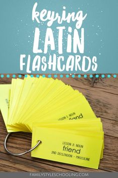 a pile of yellow cards with the words keying latin flashcards on them and a fishing hook