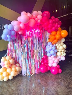 balloons and streamers are on display at a party