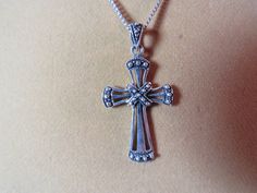 Beautiful sterling silver Christian Cross pendant necklace has a 14.5" long sterling silver chain with a 1 5/8" tall pendant.  The chain is marked STERLING, the pendant is marked 925 with a makers mark that looks like the conjoined letters MY.  The necklace weighs approx. 6.38 grams.  It is in very good condition. Formal Silver Sterling Silver Cross Necklace, Silver Cross Pendant Necklace For Formal Occasions, Formal Sterling Silver Pendant Cross Necklace, Formal Cross Pendant Necklace With Large Pendant, Formal Necklace With Large Cross Pendant, Formal Large Cross Pendant Necklace, Antique Silver Cross Necklace In Sterling Silver, Silver Cross Necklace With Large Pendant, Elegant Cross Necklace For Collectors