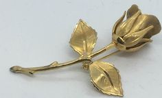 Lovely rose brooch in brushed gold finish.  Large flower head with two leaves.  From estate sale probably 1980s.  No markings.  In excellent condition. Formal Gold Brooch With Rose Design, Rose Brooch, Button Necklace, Steampunk Necklace, Mother Of Pearl Necklace, Choker Style, Large Flowers, Flower Brooch, Vintage Brooches