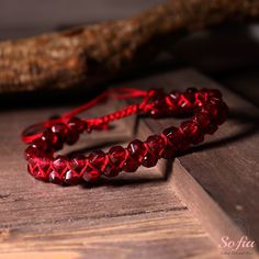 This garnet bracelet is handmade with high-quality rope. It measures about 6.5 inches in length and can be adjusted to fit your wrist size. The bracelet is lightweight and comfortable to wear. It is also easy to match with any outfit, as it has a subtle and elegant design. This bracelet is perfect for anyone who loves healing crystal jewelry, natural stones, or romantic gifts. It is a unique and meaningful gift for yourself or someone special. You can wear it alone or pair it with other jewelry for a stunning look. - Materials: Natural Garnet Stone - Size: fits for 6 ~ 8 inch wrist, adjustable - Handmade With Love and Carefully Manufactured - Due to different light and screen, the color may be slightly different from the picture. - Every natural stone is measured by hand, there may be a sl Hand Wrapped Beaded Bracelets With Waxed Cord As Gift, Red Macrame Jewelry As Gift, Spiritual Macrame Bracelets As Gift, Red Macrame Jewelry Gift, Casual Hand-strung Friendship Bracelets As Gift, Spiritual Macrame Bracelet As Gift, Casual Hand-strung Wristband - Perfect Gift, Casual Hand-strung Wristband As Gift, Adjustable Round Beads Wristband As Gift