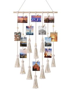 a hanging photo frame with tassels and pictures