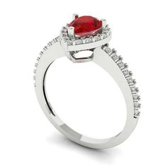 a white gold ring with a red stone and diamonds