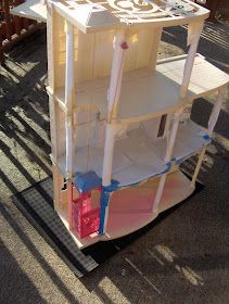 a large white shelf sitting on top of a sidewalk