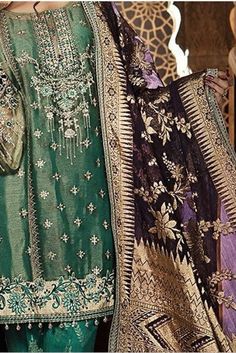 Embroidered Pure Zari Net Embroidered kameez w/ matching green jacquard printed pants! This outfit is a gorgeous teal with a matching plum purple organza jacquard dupatta and gold accents. The shirt is fully lined (arms are not lined at all). Stitched w/ swarovski buttons to add a flare!  Available for immediate shipping in a size small!! Traditional Purple Salwar Kameez With Intricate Embroidery, Green Silk Salwar Kameez For Formal Occasions, Festival Purple Salwar Kameez With Intricate Embroidery, Bollywood Style Embroidered Purple Lawn Suit, Festive Purple Lawn Suit With Zari Work, Festive Purple Lawn Suit With Resham Embroidery, Designer Embroidered Purple Lawn Suit, Purple Silk Dupatta With Intricate Embroidery, Silk Purple Dupatta With Intricate Embroidery