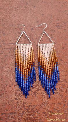 These handmade earrings are made of high-quality Czech beads and strong synthetic thread. They are elegant, fashionable, and highly versatile, suitable for everyday wear. Color: beige,blue,brown . 100% hand made with love! Measurements: Length-about 11cm (4.33 inch) Width -about 2.5 cm (1 inch) Materials: Sterling silver hook Czech glass beads Nylon Thread Bohemian Blue Triangle Earrings, Blue Bohemian Triangle Earrings, Chandelier Boho, Beige Earrings, Earrings Triangle, Abstract Floral Print, Earring Tutorial, Triangle Earrings, Beaded Hoop Earrings