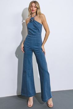 This exquisite jumpsuit boasts a washed denim fabric with a stunning halter neckline, delicate corsage detail, and a graceful, flare pant silhouette. Complete with a sleek back zipper closure, it exudes effortless elegance and sophistication. Details:Self : 75% Cotton, 23% Polyester, 2% SpandexSize & Fit- Model is 5`8" And Wearing Size Small- Measurements Taken From Size Small- Approx. Length: 60" Luxury Summer Denim Overall Jumpsuit, Cheap Non-stretch Summer Denim Jumpsuit, Chic Cheap Denim Jumpsuit For Women, Cheap Non-stretch Denim Jumpsuit For Summer, Cheap Sleeveless Denim Jumpsuit With Button Closure, Luxury Fitted Blue Denim Jumpsuit, Spring Denim Jumpsuit With Side Pockets, Cheap Washed Denim Blue Jumpsuit, Cheap High-rise Denim Jumpsuit With Pockets