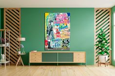 a living room with green walls and wooden flooring is furnished with an art piece on the wall