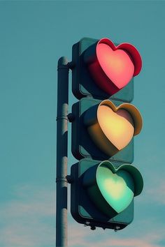 a traffic light with two hearts on it