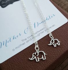 perfect charm to celebrate beautiful motherhood. openwork elephant charm necklace set.925 sterling silver ifnish.16-18'' adjustable chain.mother elephant charm-18x15mmbaby elephant charm-15x13mm Adjustable Nickel-free Charm Necklace For Mother's Day, Silver Dangle Charm Necklaces For Mother's Day, Nickel-free Charm Necklaces For Best Friend Gift, Dainty Silver Charm Necklace For Mom, Sterling Silver Dangle Jewelry As Gift For Mom, Sterling Silver Necklace For Best Friend On Mother's Day, Adjustable Silver Charm Necklaces For Mother's Day, Handmade Jewelry For Best Friend Gift, Silver Sterling Jewelry For Best Friend Gift