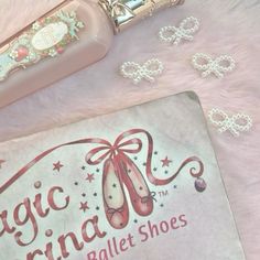 a pink bag next to a pair of ballet shoes on a white surface with the words magic virginia ballet shoes