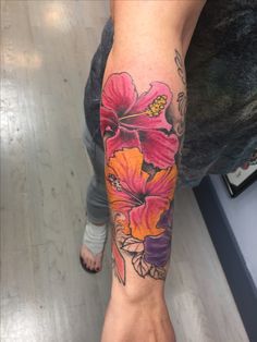 a person with a flower tattoo on their arm