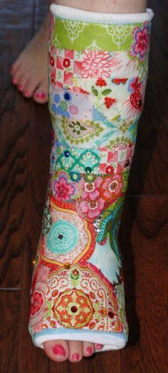 the foot is covered with colorful fabric