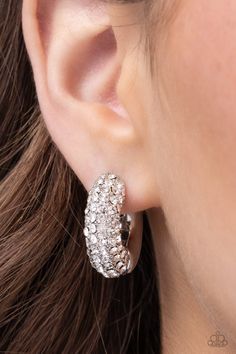 Embellished with an explosion of glittering white rhinestones, silver hoops curl around the ear for a chic, combustible look. Earring attaches to a standard hinge closure fitting. Hoop measures approximately 3/4" in diameter. Sold as one pair of hinge hoop earrings. SKU: P5HO-WTXX-163XX