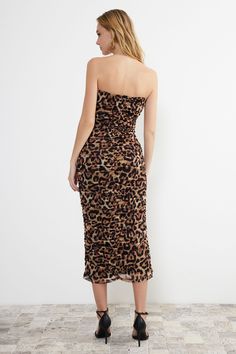 Description: Turn heads with our Elegant Strapless Leopard Print Midi Dress. This bold and beautiful dress features a stunning leopard print design and a flattering ruched silhouette. The strapless cut adds a touch of elegance, making it perfect for special occasions, evening events, or a night out. Made from high-quality, stretchable fabric, this dress ensures comfort while keeping you stylish. Pair it with statement earrings and strappy heels for a complete, show-stopping look. Features: • Strapless design • Bold leopard print • Flattering ruched silhouette • Midi length • High-quality, stretchable fabric Care Instructions: • Hand wash cold separately • Do not bleach • Lay flat to dry • Cool iron if needed • Leopard print dress • Strapless midi dress • Ruched leopard print dress • Women’ Summer Ruched Leopard Print Dress, Summer Leopard Print Ruched Dress, Fitted Ruched Leopard Print Dresses, Leopard Print Ruched Dress For Night Out, Leopard Print Ruched Dress For Party, Ruched Leopard Print Dress For Party, Ruched Leopard Print Party Dress, New Fashion Dress, Spring Maxi Dress