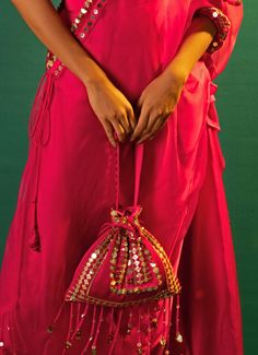 This elegant Pink Embroidered and Handcrafted Potli is a stunning accessory, crafted from luxurious satin and adorned with intricate hand-embroidered lace. The rich detailing includes mirror-like sequins and meticulously designed borders, offering a perfect blend of tradition and contemporary style. Ideal for weddings or festive outfits, this potli adds a touch of sophistication. This beautifully embellished bag ensures a fully styled, elegant look. Carry your essentials in style with this timeless piece. Composition : SatinCare: Dry Clean Only and Vacuum Storage This product can be customized for sleeves, blouse length and neckline Delivery : 2-4 weeks as the product is hand crafted. Check Size Guide or choose MySize for free customisation (All Sizes above XL can be made at 15% additional Stylish Drapes, Indian Wedding Wear, Blouse Length, Wedding Wear, Embroidered Lace, Festival Outfits, Timeless Pieces, Indian Wedding, Contemporary Style