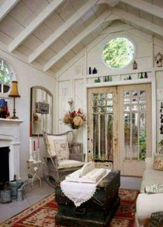 a living room filled with furniture and a fire place