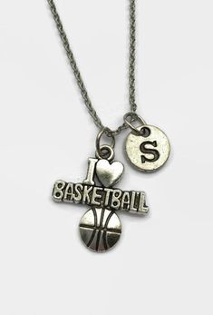 two necklaces that say i love basketball and one has a heart on the front