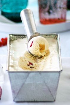 a scoop of ice cream in a metal container