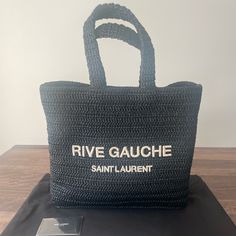 Saint Laurent Tote Bag In Raffia-Like Fabric Feature Embroidered "Rive Gauche" Logo At Front One Main Interior Compartment One Zip-Up Pocket Flat Top Handles, 7.1" Drop Open Top Approx. 13.7"W X 14.9"W X 5.7"D Unlined Interior Made In Italy New With Dust Bag And Cards. Saint Laurent Tote Bag, Saint Laurent Tote, Rive Gauche, Saint Laurent Bag, Flats Top, Open Top, Zip Up, Saint Laurent, Zip Ups