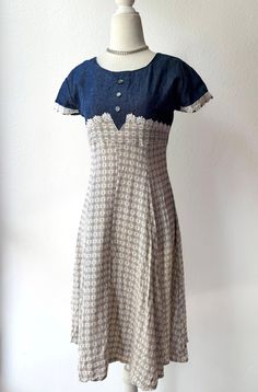 No size tag, best fits S! Insane vintage babydoll dress with a denim bodice & a white/blue patterned skirt. Ties at the back. No notable flaws aside from a couple loose threads. Band is Jeffrey Seen on a size 4/6 mannequin  Message me with any questions! :) FREE US SHIPPING Indigo Cotton Dress With Buttons, Fitted Vintage Blue Denim Dress, Fitted Blue Vintage Denim Dress, Fitted White Cotton Denim Dress, Vintage Short Sleeve Denim Dress For Summer, Vintage Fitted Medium Wash Dresses, Retro Fitted Denim Summer Dress, Vintage Medium Wash Summer Dress, Fitted Retro Blue Denim Dress