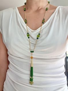 long necklace in glass beads and jade, green and gold, with pendant formed of a golden cone and a pompom of small green beads. Gold metal clasp. Length of the collar part: 76cm. Pendant height: 11cm. Handmade in France. Green Beads, Green Bead, Jade Green, Long Necklace, Green And Gold, Favorite Jewelry, Gold Metal, Jade, Glass Beads