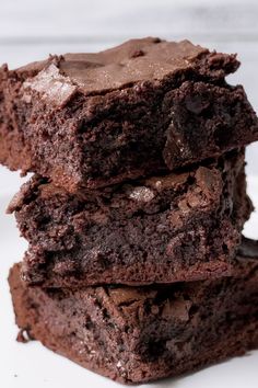 three chocolate brownies stacked on top of each other