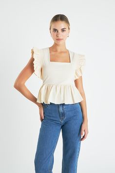 Glow up your wardrobe with this chic Square Neckline Ruffled Top. It features a square neckline sleeveless construction a peplum detail at the bottom and pleated ruffle shoulder for an edgy yet sophisticated look. Dress it up with heeled sandals for a night out or go casual with sneakers. It's perfect for any occasion making it a must-have item in your collection. Get this stylish top now and let it level up your wardrobe! Square neckline Sleeveless Bottom peplum detail Pleated ruffle shoulder R Chic Fitted Peplum Top With Ruffle Hem, Fitted Peplum Top With Ruffle Hem For Day Out, Chic Fitted Peplum Top, Chic Peplum Top With Ruffle Sleeves, Fitted Ruffles Peplum Top For Day Out, Fitted Ruffle Peplum Top For Day Out, Chic Ruffled Peplum Top For Work, Summer Feminine Peplum Top For Workwear, Chic Tops With Ruffle Hem And Straps