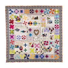 a quilt with many different designs on it