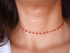 This modern stacking  chocker necklace is made with Gold Plated Rosary Chain adorned with Red Cristal Glass Beads. ➵ Perfect to wear as Chocker or Double turn Bracelet.➵ The necklace length is ajustable thanks to 5 cm extender chain.--*--*--*--*--*--*--*--*--*--*--*--*--*--*--*--*--*--*--∞ SIZE ∞- length: 32 cm (12,6 in) to 37 cm (14,6 in) with the little extender chain.Closing-system : Adjustable∞ MATERIAL ∞- Gold plated over brass- Cristal BeadsNickel free jewelry !∞ COLOR ∞- Gold- Red--*--*-- Trendy Red Necklaces With Round Beads, Trendy Red Round Bead Necklaces, Trendy Red Round Beads Necklace, Trendy Red Beaded Necklaces, Minimalist Faceted Bead Choker Necklace, Trendy Red Necklace With Tiny Beads, Dainty Faceted Bead Choker Necklace, Trendy Red Beaded Necklace For Party, Trendy Red Choker As Gift