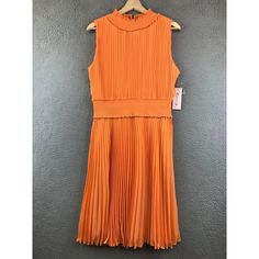 New Nanette Lepore Pleated High Neck Coral Pink Orange Day Dress Size 12 Condition ~The Dress Is New With Tag Attached. From Nonsmoking Environment. No Stains, Snags, Pilling, Odors, Or Excessive Signs Of Wear Unless Specifically Noted. Please See The Photo For Measurements. Shipping: Fast Shipping. All Items Will Be Shipped Within 1 Business Day Of Payment (Which Excludes Weekend And Holidays). Fitted Orange Pleated Dress, Casual Pleated Orange Dress, Casual Orange Pleated Dress, Fitted Orange Pleated Midi Dress, Orange Pleated Sleeveless Midi Dress, Orange Pleated Midi Dress For Spring, Crochet Dress Boho, Black Eyelet Dress, Nanette Lepore Dress