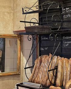 breads and pastries are on display at a bakery