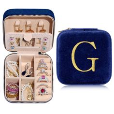 an open blue case filled with lots of jewelry