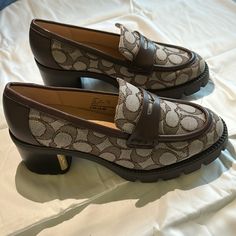 Coach Cora Loafers, Size 6. Never Worn, New Condition, No Box. Brown Almond Toe Loafers With Branded Heel Counter, Coach Fall Loafers With Round Toe, Coach Loafers With Round Toe For Fall, Coach Casual Closed Toe Heels, Coach Casual Loafers, Coach Casual Loafers With Flat Heel, Coach Loafers For Spring Workwear, Fall Coach Slip-on Loafers, Fall Coach Loafers With Round Toe