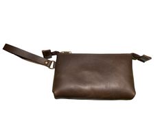 This wristlet is perfect for carrying your essentials in style. It's made of oil tanned leather that has a rich and natural look. The wrist strap is detachable, so you can use it as a clutch or a pouch. The zipper closure keeps your items secure and easy to access. Wristlet comes in two sizes, 6.5" x 5.0" x 2.25, which is spacious enough for your phone and keys, and 8.5" x 5.5" x 2.25" which will hold a phone, keys, a wallet and more. Measurements are approximate and each wristlet is unique. Han Brown Clutch Pouch With Wrist Strap, Brown Pouch With Wrist Strap For Daily Use, Brown Leather Clutch With Wrist Strap, Leather Pouch With Wrist Strap, Brown Leather Wristlet For Everyday Use, Brown Leather Clutch Wristlet, Brown Leather Wristlet With Removable Pouch, Leather Wristlet With Wrist Strap, Brown Leather Travel Wristlet